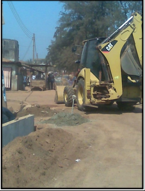 Earthmoving equipment supporting civil works at College Road in Enugu